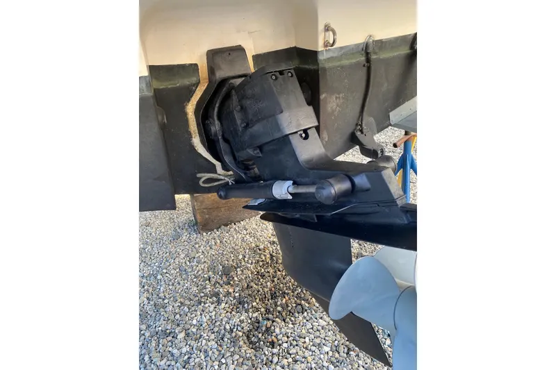 Slide: The Image of 2006 Maxum 2600 SE boat stern drive and propeller on gravel surface. - 39