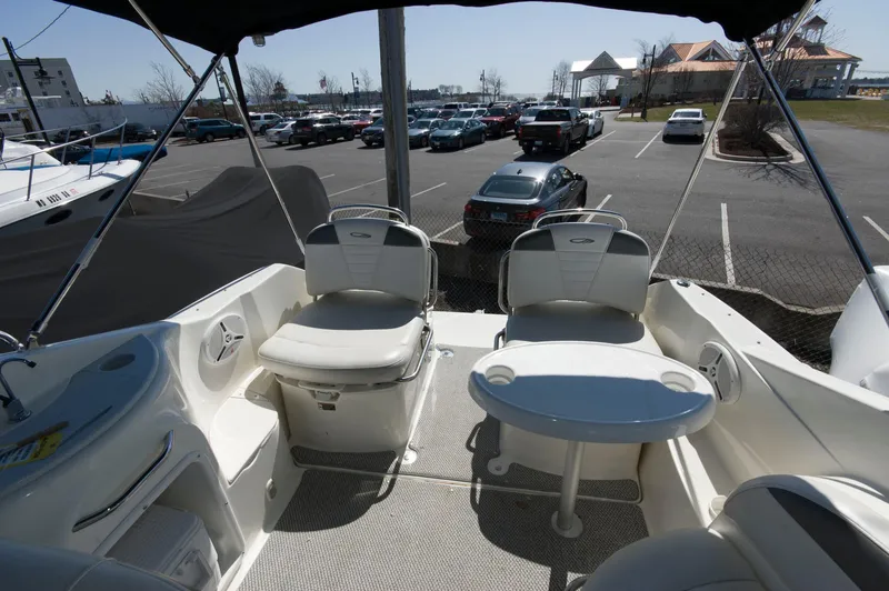 Slide: The Image of Interior of a 2006 Maxum 2600 SE boat with seating area. - 5