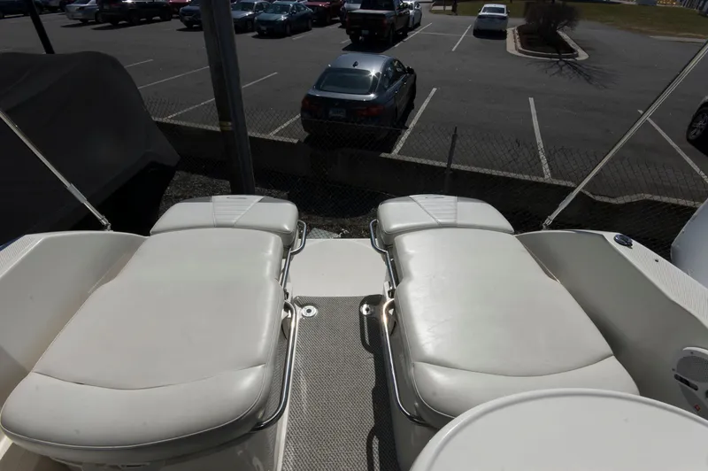 Slide: The Image of 2006 Maxum 2600 SE boat interior with white seating. - 6