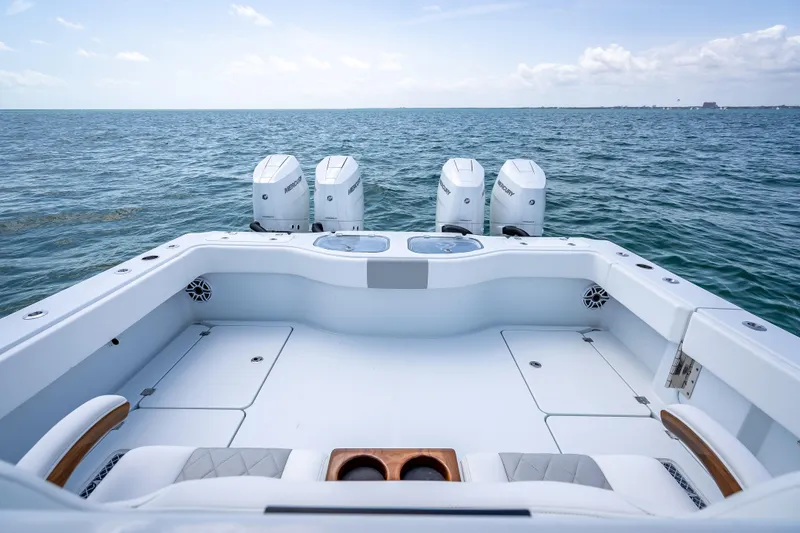 Slide: The Image of Freeman 43 boat, 2025 model, with triple Mercury engines on open sea. - 100