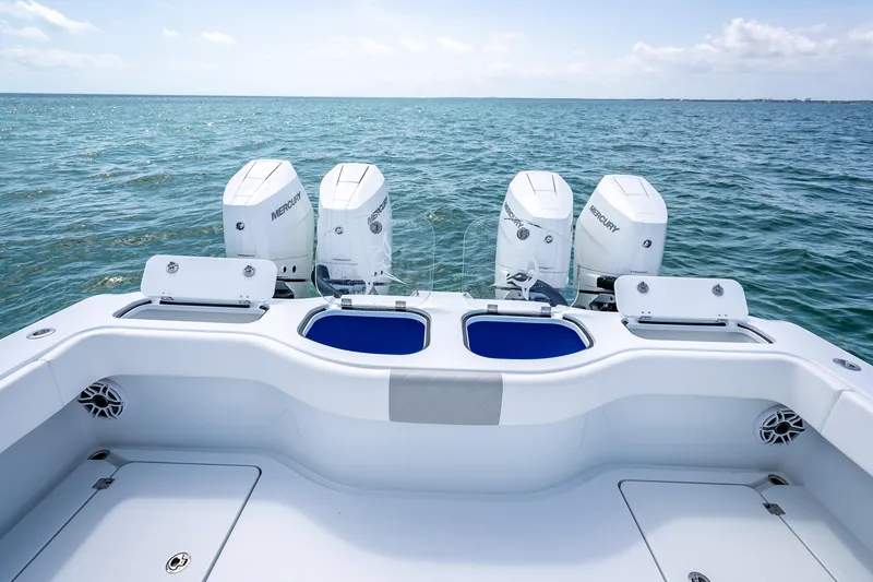 Slide: The Image of Freeman 43 boat with four Mercury engines on open sea, 2025 model. - 101