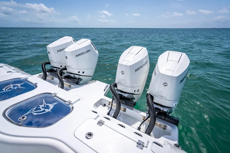 Slide: The Image of Freeman 43 boat with four Mercury outboard engines on open sea, 2025 model. - 104