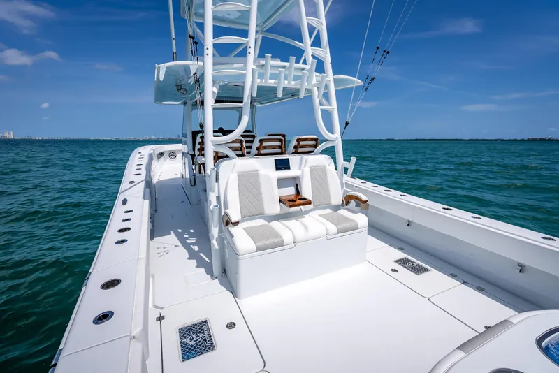Slide: The Image of 2025 Freeman 43 boat on open water, featuring sleek design and spacious deck. - 105