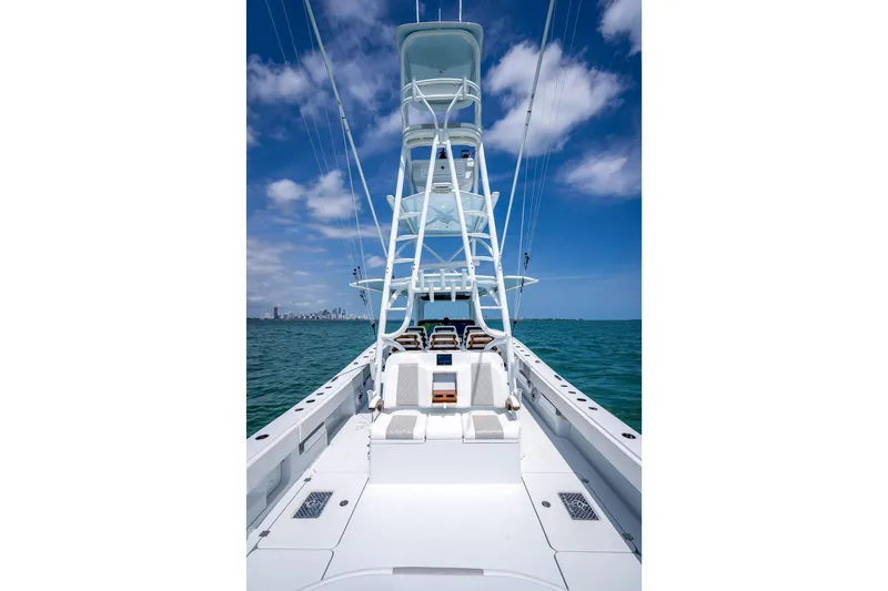 Slide: The Image of 2025 Freeman 43 boat on open water under blue sky. - 109