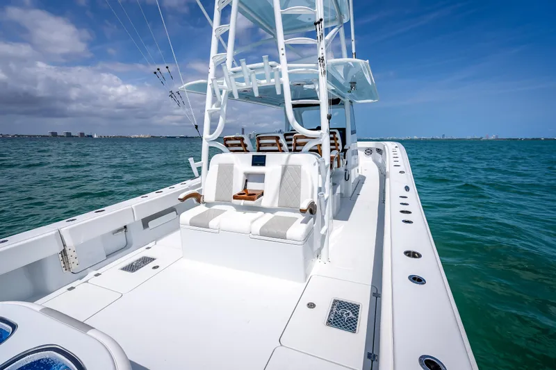 Slide: The Image of 2025 Freeman 43 boat on open water, featuring sleek design and spacious deck. - 110