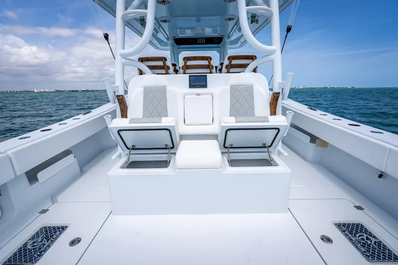 Slide: The Image of Freeman 43 boat interior, 2025 model, featuring luxurious seating and ocean backdrop. - 112