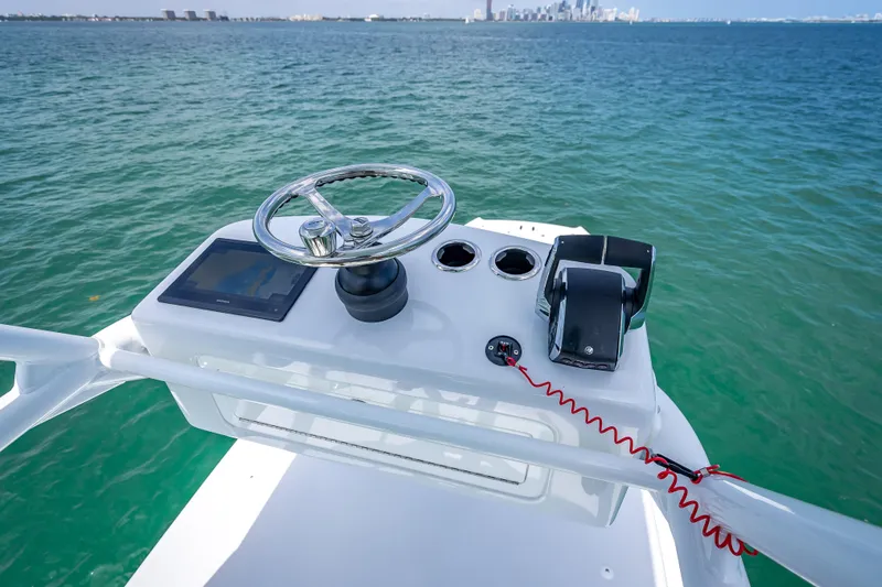 Slide: The Image of Steering console of 2025 Freeman 43 boat with ocean view and city skyline. - 114