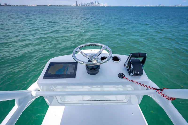 Slide: The Image of Helm of 2025 Freeman 43 boat with steering wheel and navigation system. - 115