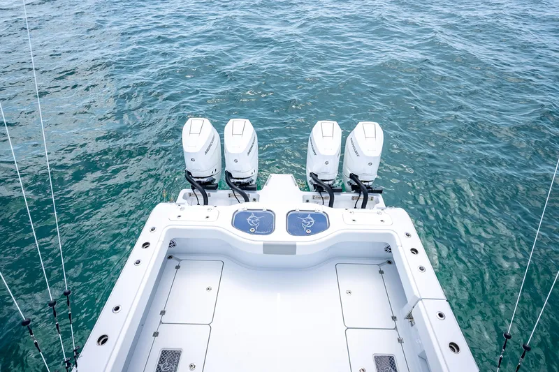 Slide: The Image of 2025 Freeman 43 boat with quad outboard motors on open water. - 120