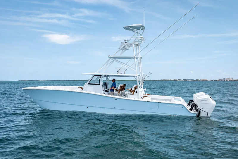 Slide: The Image of 2025 Freeman 43 boat on open water with clear sky background. - 16