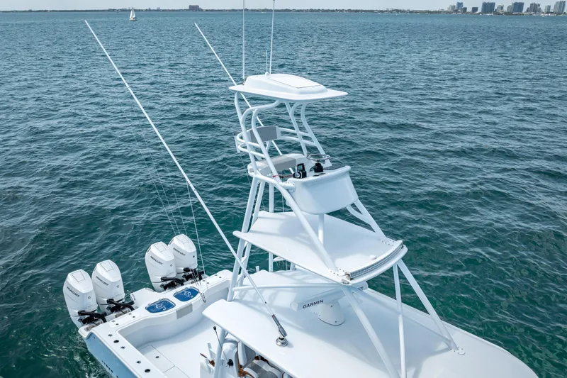 Slide: The Image of 2025 Freeman 43 boat with tower and multiple outboard engines on open water. - 26