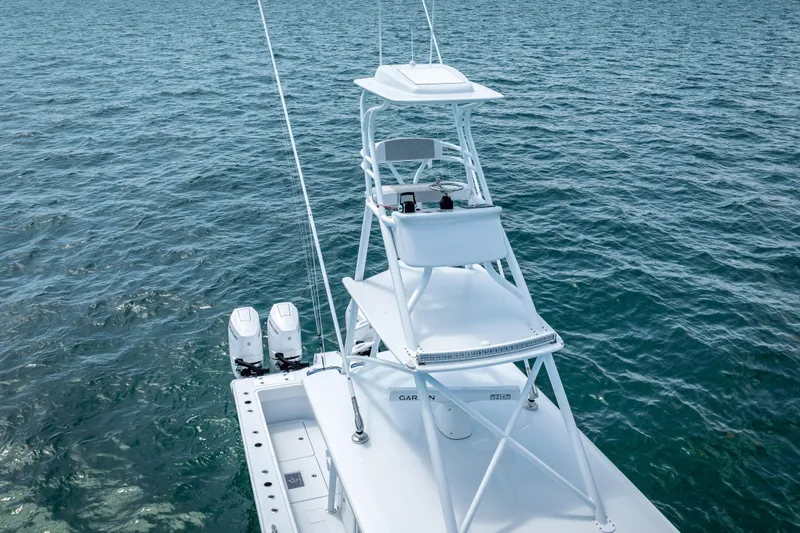 Slide: The Image of 2025 Freeman 43 boat with dual engines on open water. - 27