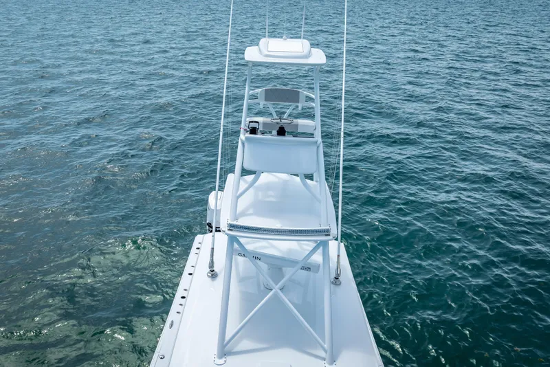 Slide: The Image of 2025 Freeman 43 boat on open water, showcasing sleek design and elevated helm. - 28