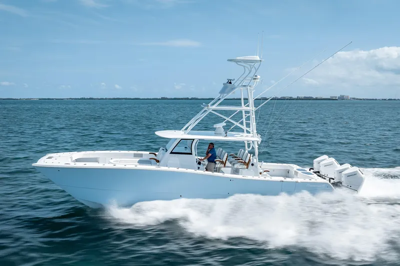 Slide: The Image of 2025 Freeman 43 boat cruising on open water under clear blue skies. - 37