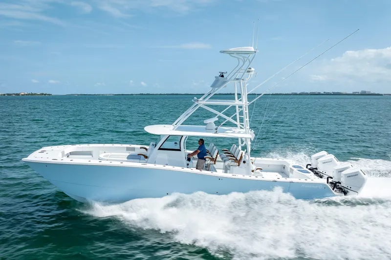 Slide: The Image of 2025 Freeman 43 boat cruising on open water under clear blue sky. - 41