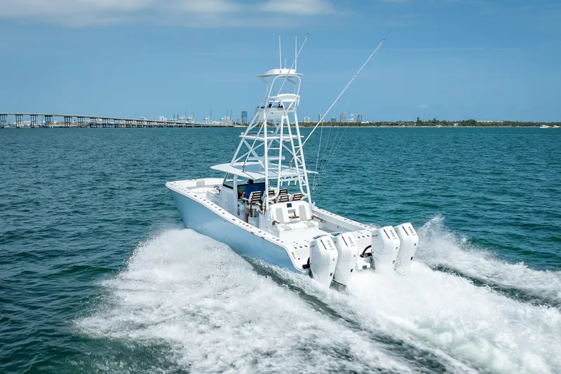 Slide: The Image of 2025 Freeman 43 boat cruising on open water with four powerful engines. - 46