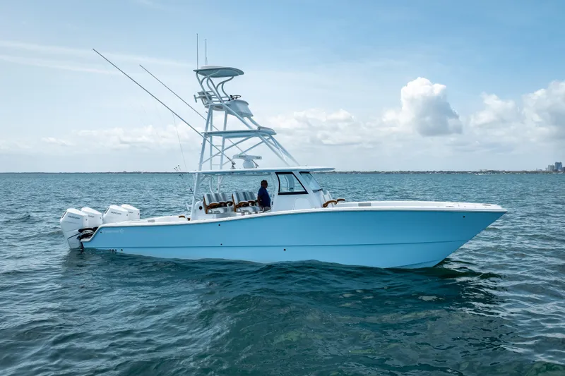 Slide: The Image of 2025 Freeman 43 boat on open water, clear sky, and calm sea. - 6