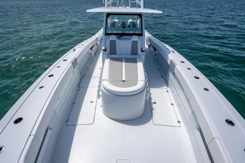 Slide: The Image of 2025 Freeman 43 boat on open water, showcasing sleek design and spacious deck. - 60