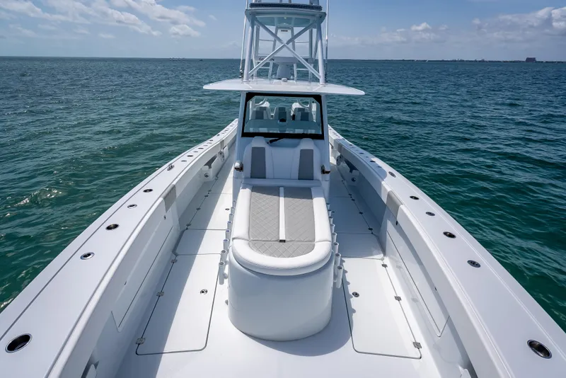Slide: The Image of 2025 Freeman 43 boat on open sea, showcasing sleek design and spacious deck. - 61