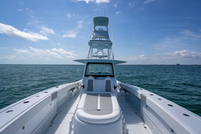 Slide: The Image of 2025 Freeman 43 boat on open sea under clear blue sky. - 63