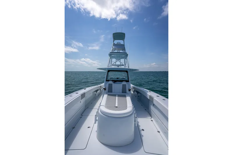 Slide: The Image of 2025 Freeman 43 boat on open water under clear blue sky. - 64