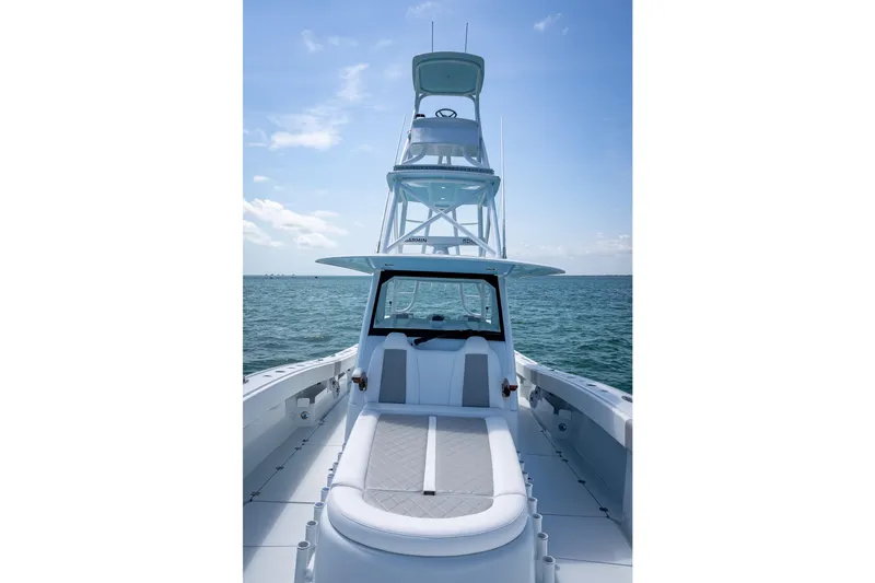 Slide: The Image of 2025 Freeman 43 boat on open water, featuring sleek design and spacious deck. - 65