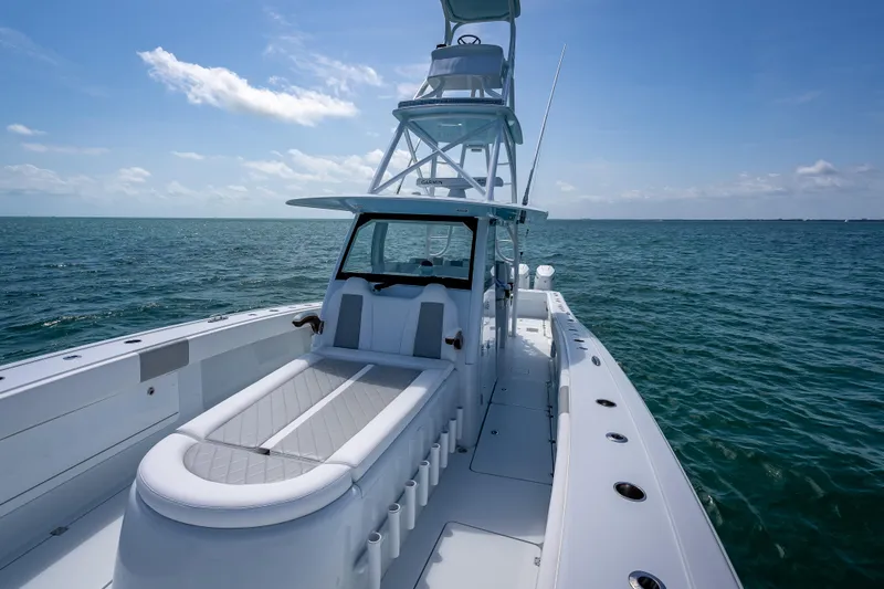 Slide: The Image of 2025 Freeman 43 boat on open sea, featuring sleek design and spacious deck. - 67