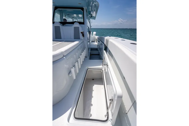 Slide: The Image of 2025 Freeman 43 boat interior with open storage compartment, sleek design, and ocean view. - 70
