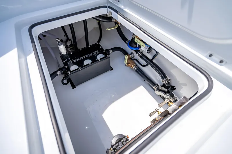 Slide: The Image of Freeman 43 boat compartment with mechanical components, 2025 model. - 73