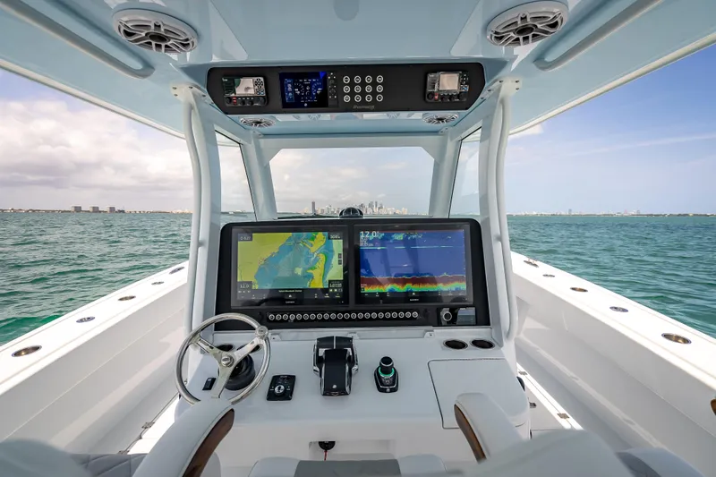 Slide: The Image of Cockpit view of 2025 Freeman 43 boat with advanced navigation system on open water. - 85