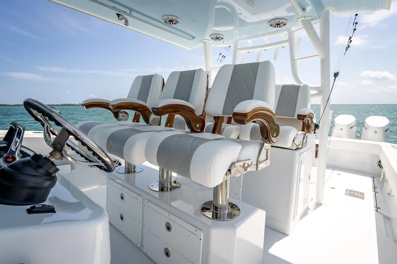 Slide: The Image of Luxury seating on 2025 Freeman 43 boat, featuring elegant design and ocean backdrop. - 87
