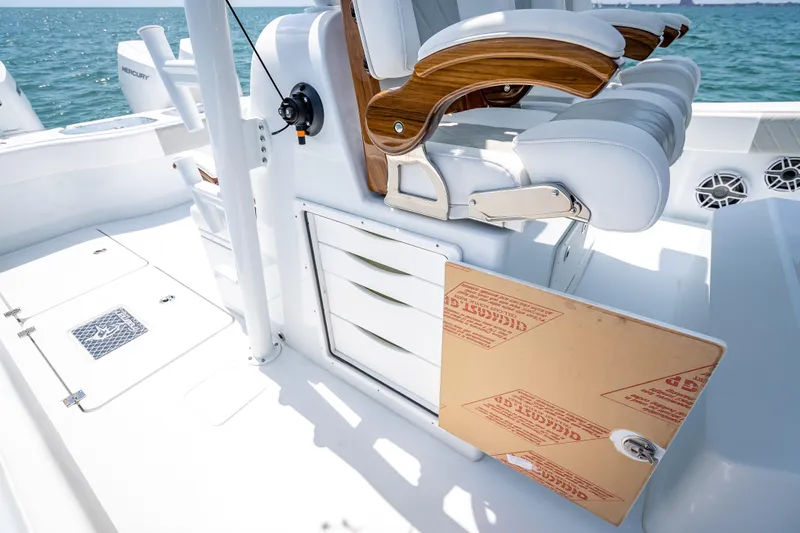 Slide: The Image of Luxurious seating and storage on a 2025 Freeman 43 boat, featuring sleek design and ocean backdrop. - 91