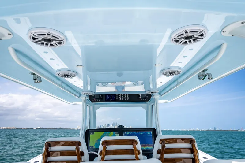 Slide: The Image of 2025 Freeman 43 boat interior with advanced navigation system and ocean view. - 93