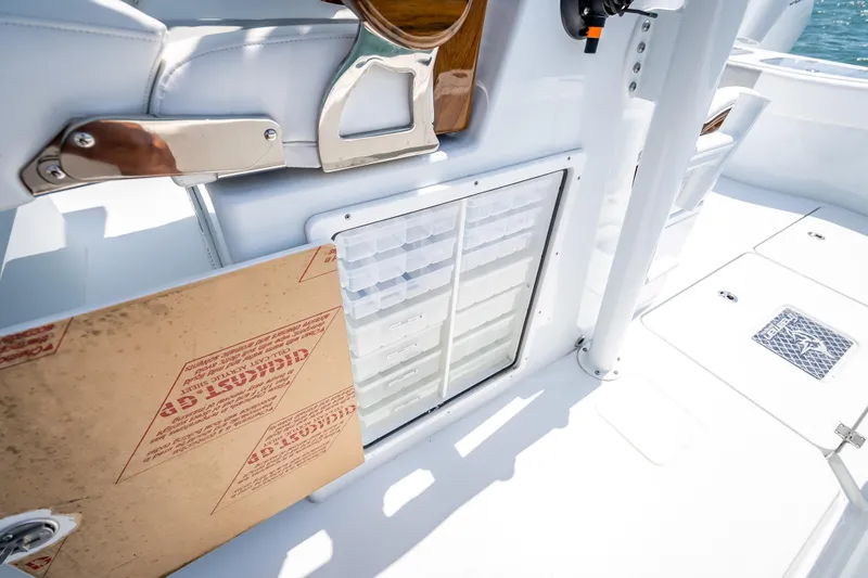 Slide: The Image of Freeman 43 boat interior, 2025 model, featuring storage compartments and sleek white design. - 96