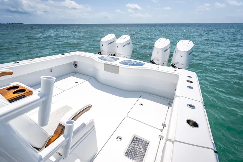 Slide: The Image of 2025 Freeman 43 boat with four Mercury engines on open sea. - 97