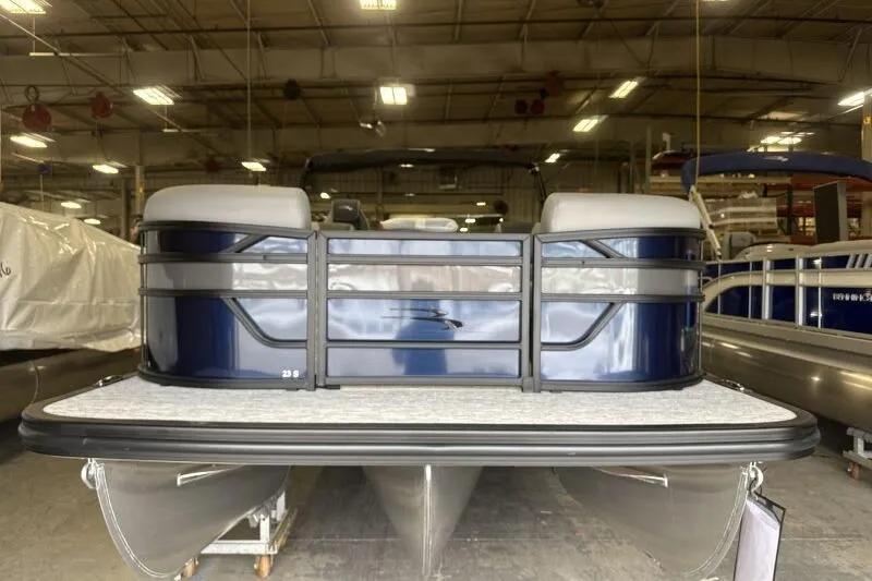 Slide: The Image of 2026 Bennington 23 SSBSF pontoon boat in a showroom, front view. - 4