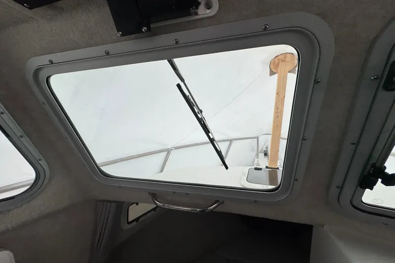 Slide: The Image of 2023 Parker 2120 Sport Cabin interior view through windshield with wiper. - 12