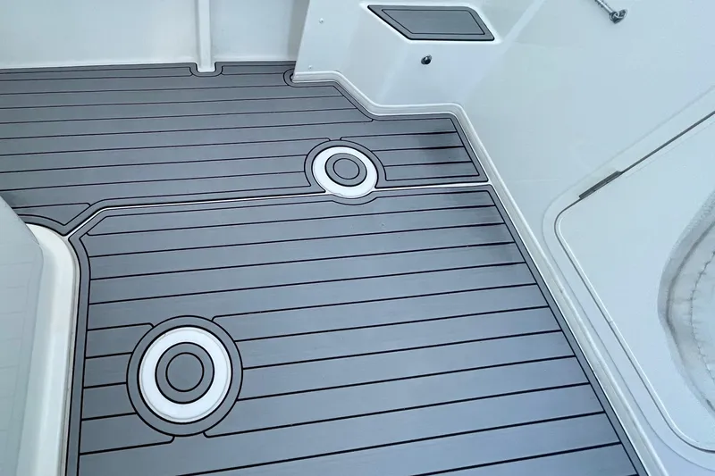 Slide: The Image of 2023 Parker 2120 Sport Cabin deck with sleek, modern design and circular accents. - 19