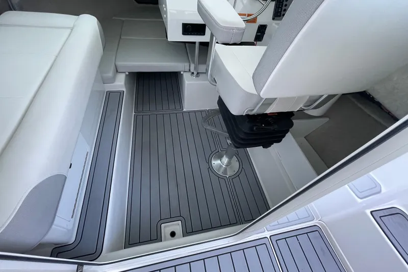 Slide: The Image of 2023 Parker 2120 Sport Cabin interior with sleek seating and modern flooring design. - 23