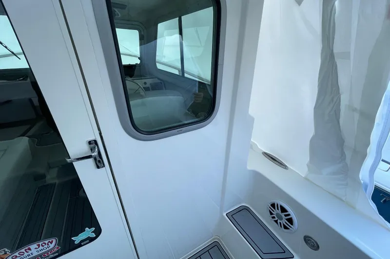 Slide: The Image of 2023 Parker 2120 Sport Cabin interior view with window and door details. - 27