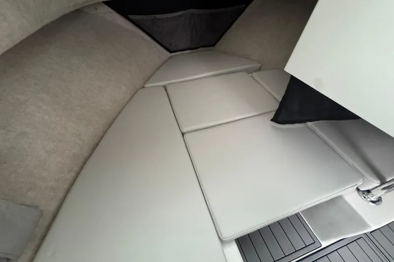 Slide: The Image of 2023 Parker 2120 Sport Cabin interior with cushioned seating and modern design. - 8