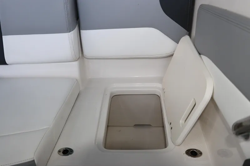 Slide: The Image of 2026 Chaparral 19 SSi OB boat storage compartment with open hatch. - 15