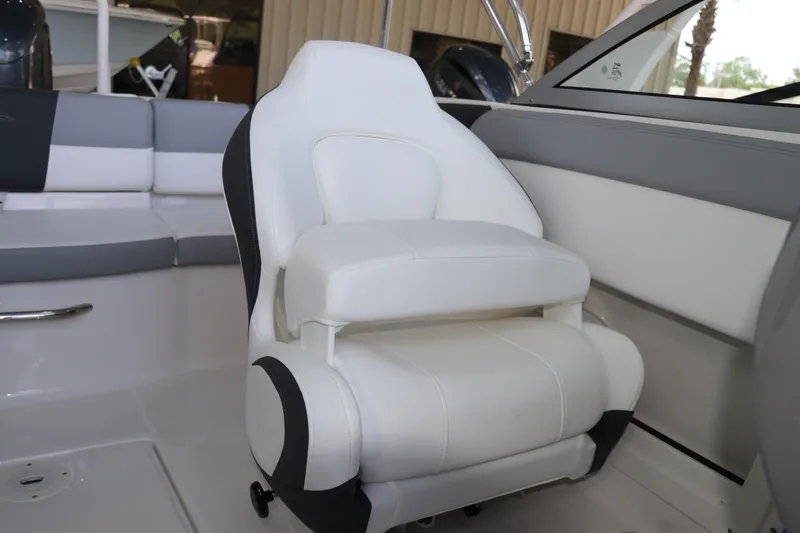 Slide: The Image of 2026 Chaparral 19 SSi OB boat interior with white and gray seating. - 18