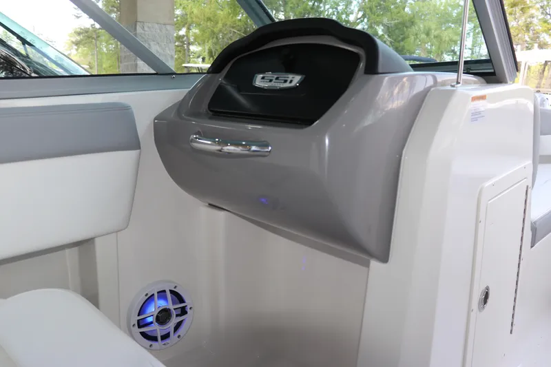 Slide: The Image of Interior view of 2026 Chaparral 19 SSi OB boat, featuring sleek design and speaker system. - 20