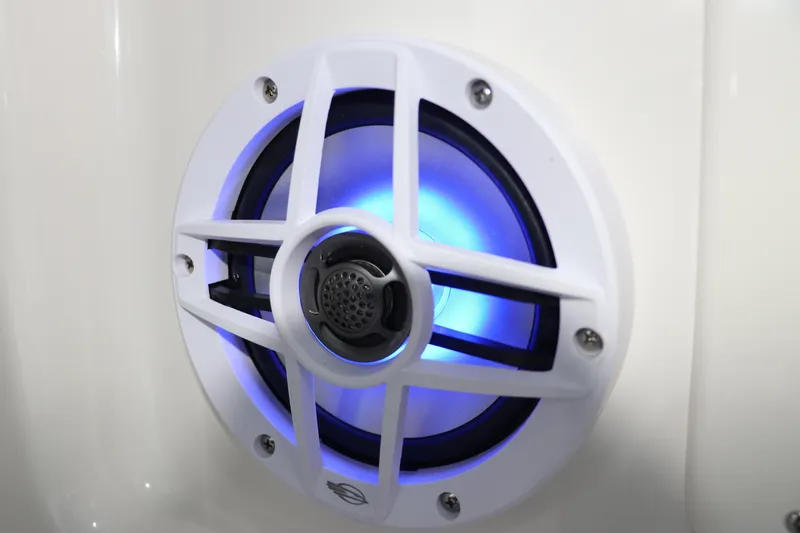 Slide: The Image of Illuminated speaker on 2026 Chaparral 19 SSi OB boat, featuring blue LED lighting. - 25