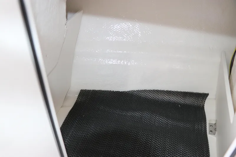 Slide: The Image of Interior storage compartment of 2026 Chaparral 19 SSi OB boat. - 31