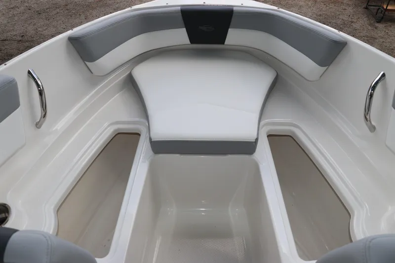 Slide: The Image of 2026 Chaparral 19 SSi OB boat interior with cushioned seating and storage compartments. - 33
