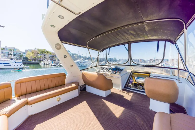 Slide: The Image of Interior view of a 1996 Navigator 5300 Classic yacht with seating and helm. - 21