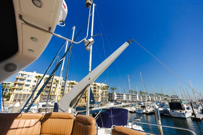 Slide: The Image of 1996 Navigator 5300 Classic yacht docked in a sunny marina with blue sky. - 30