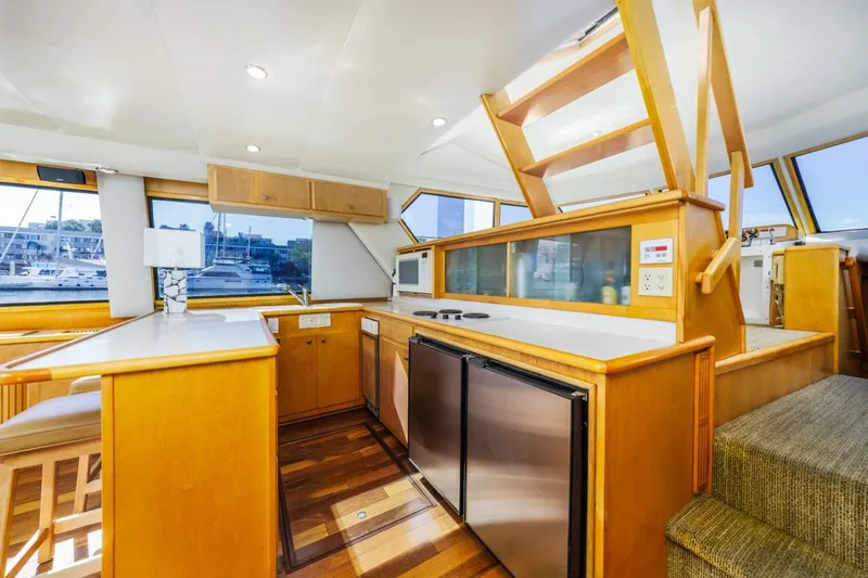 Slide: The Image of Interior of 1996 Navigator 5300 Classic yacht with modern kitchen and wooden finishes. - 34